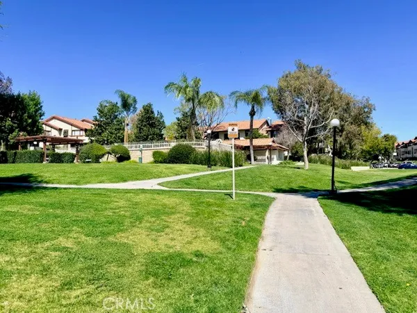 a view of a park with houses