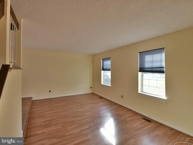 a view of kitchen with refrigerator a window and a kitchen island
