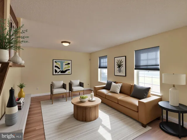 a kitchen with stainless steel appliances granite countertop a refrigerator a sink a stove a oven with a dining table and chairs