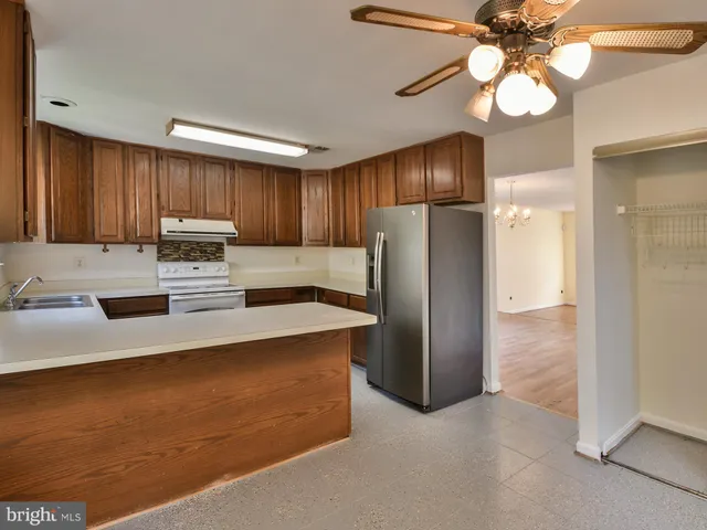 a view of a deck with couches and wooden floor