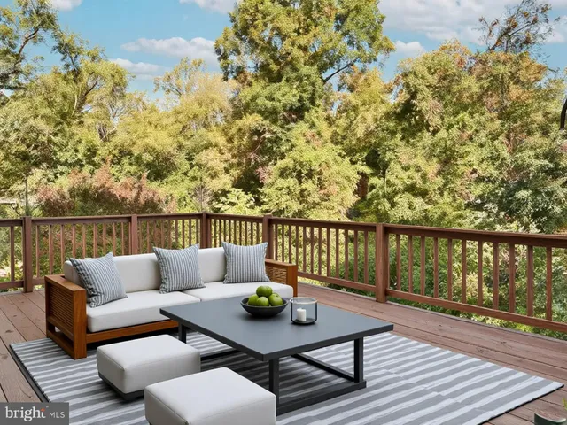 a view of an empty room and window with wooden floor