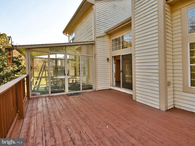 a bathroom with a tub sink shower and mirror