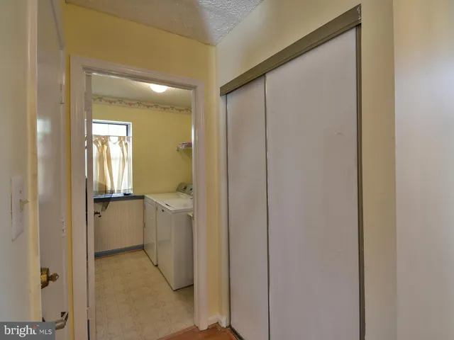 a bathroom with a glass door shower