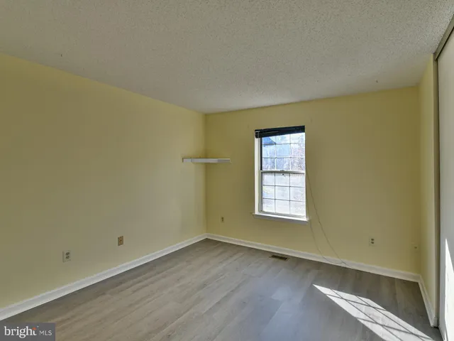 a view of a kitchen counter space and wooden floor