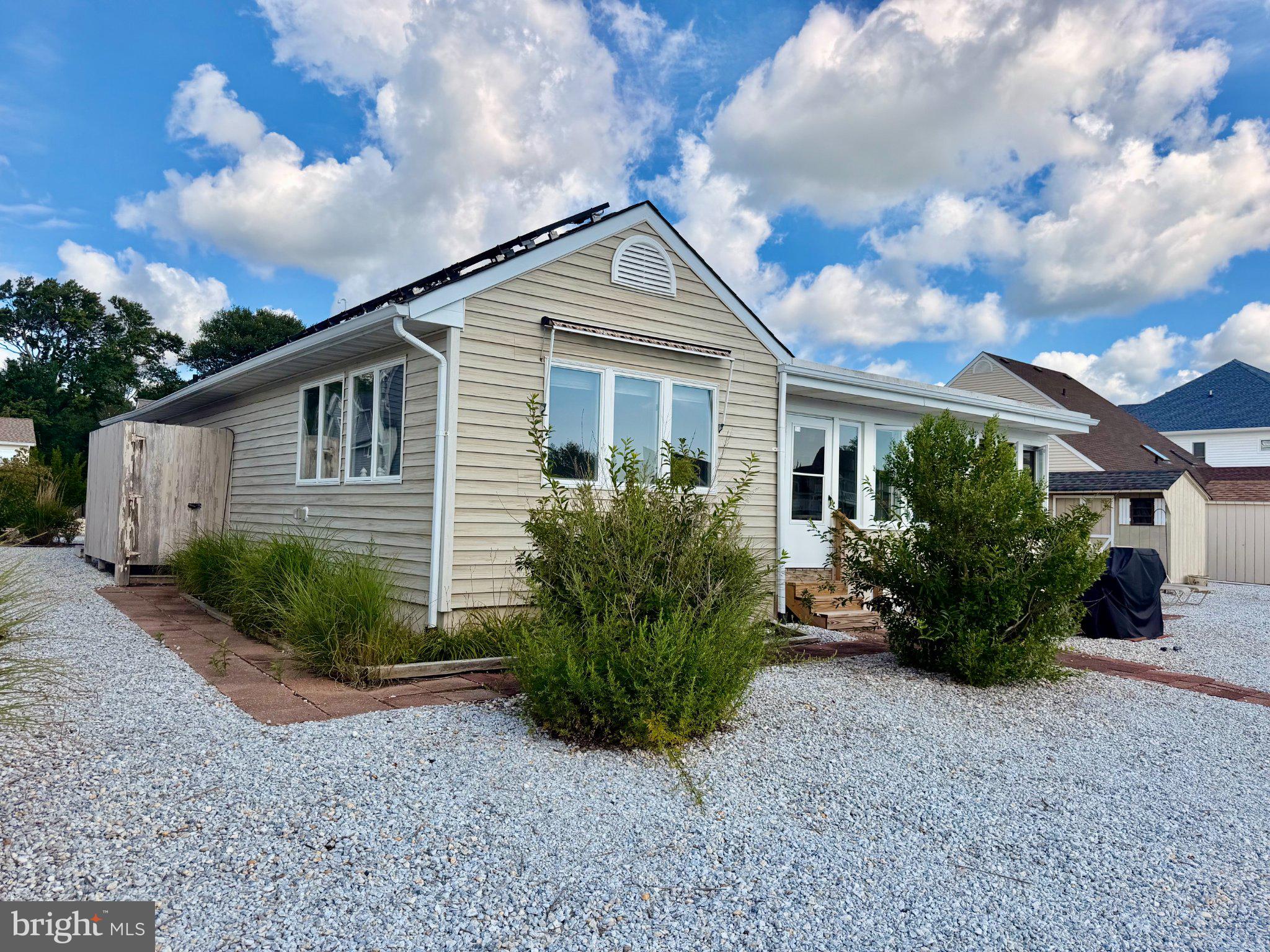 211 William Cook Boulevard Manahawkin, NJ 08050 - Photo 49 of 71 Charming home with lush greenery.