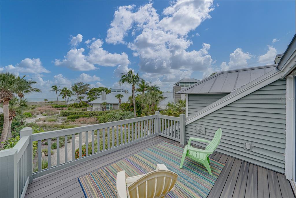 12 Seawatch Drive Boca Grande, FL 33921 - Photo 42 of 54 a view of a balcony with wooden floor