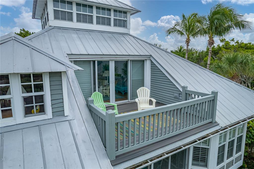 12 Seawatch Drive Boca Grande, FL 33921 - Photo 44 of 54 a view of house with roof deck and potted plants