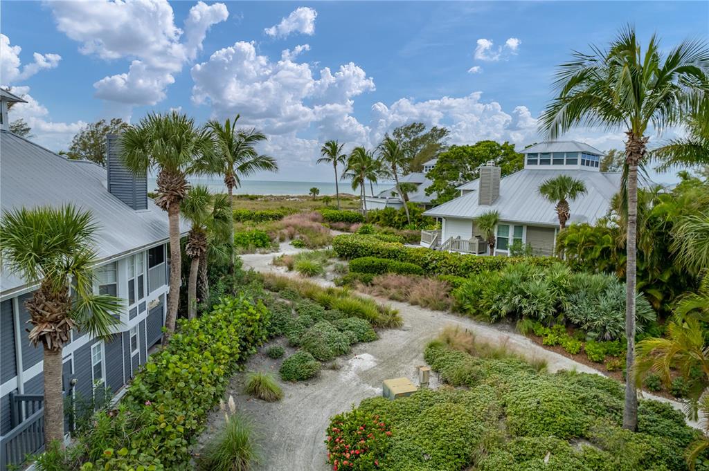12 Seawatch Drive Boca Grande, FL 33921 - Photo 46 of 54 a view of a garden with a building in the background