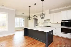 a view of a kitchen with a sink and a window