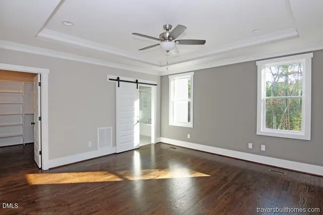 a bathroom with a granite countertop tub sink and mirror