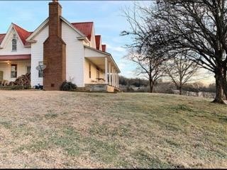 415 Corley Road Liberty, TN 37095 - Photo 9 of 19 a front view of a house with a yard