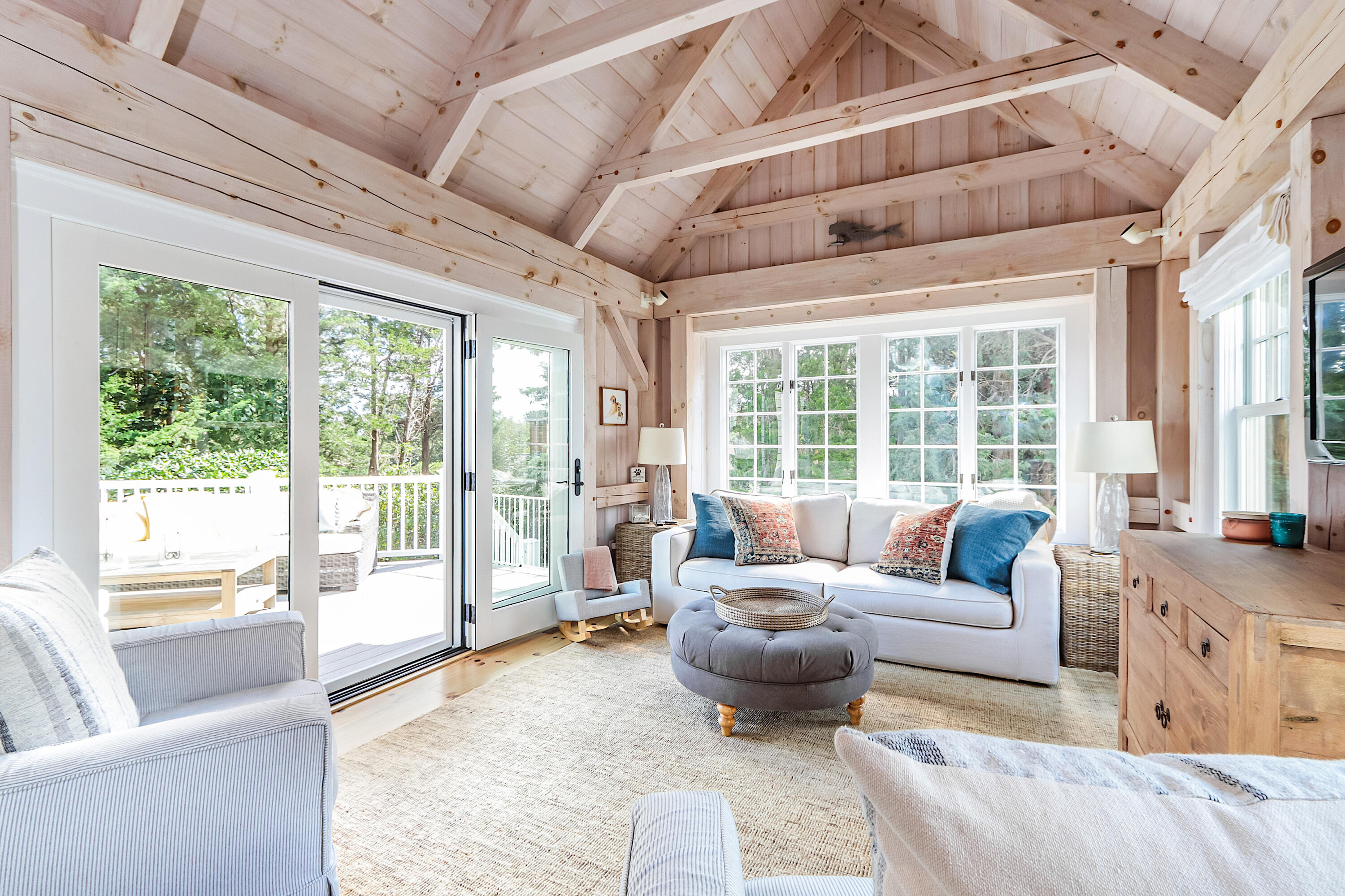 330 Sandy Neck Road West Barnstable, MA 02668 - Photo 15 of 45 a living room with furniture and a large window with garden view