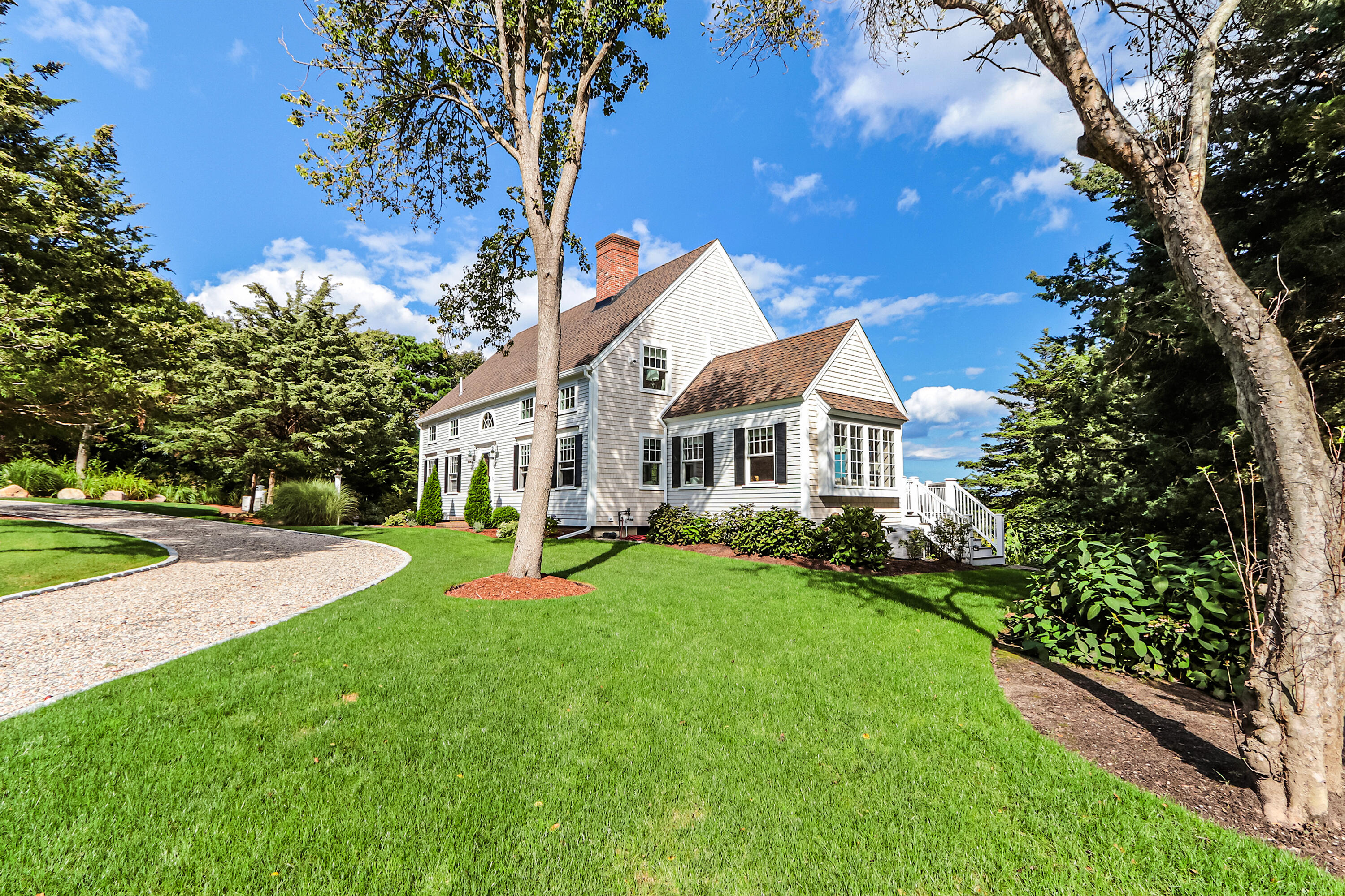 330 Sandy Neck Road West Barnstable, MA 02668 - Photo 2 of 45 a front view of a house with garden