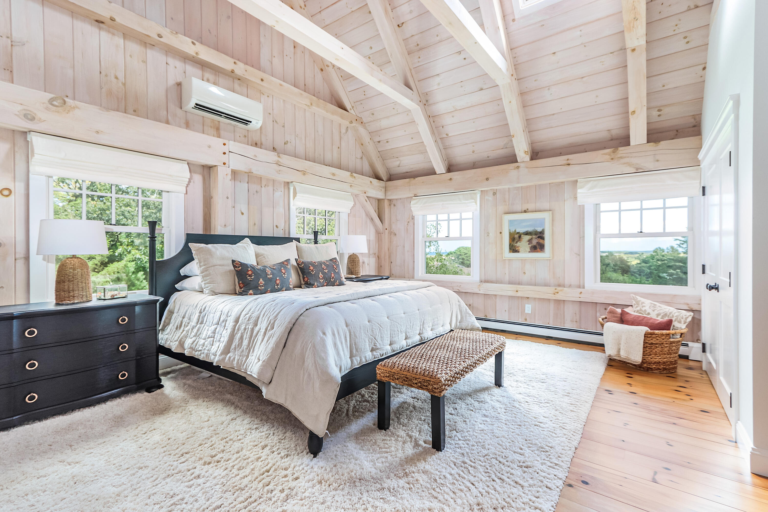330 Sandy Neck Road West Barnstable, MA 02668 - Photo 24 of 45 a spacious bedroom with a bed and wooden floor
