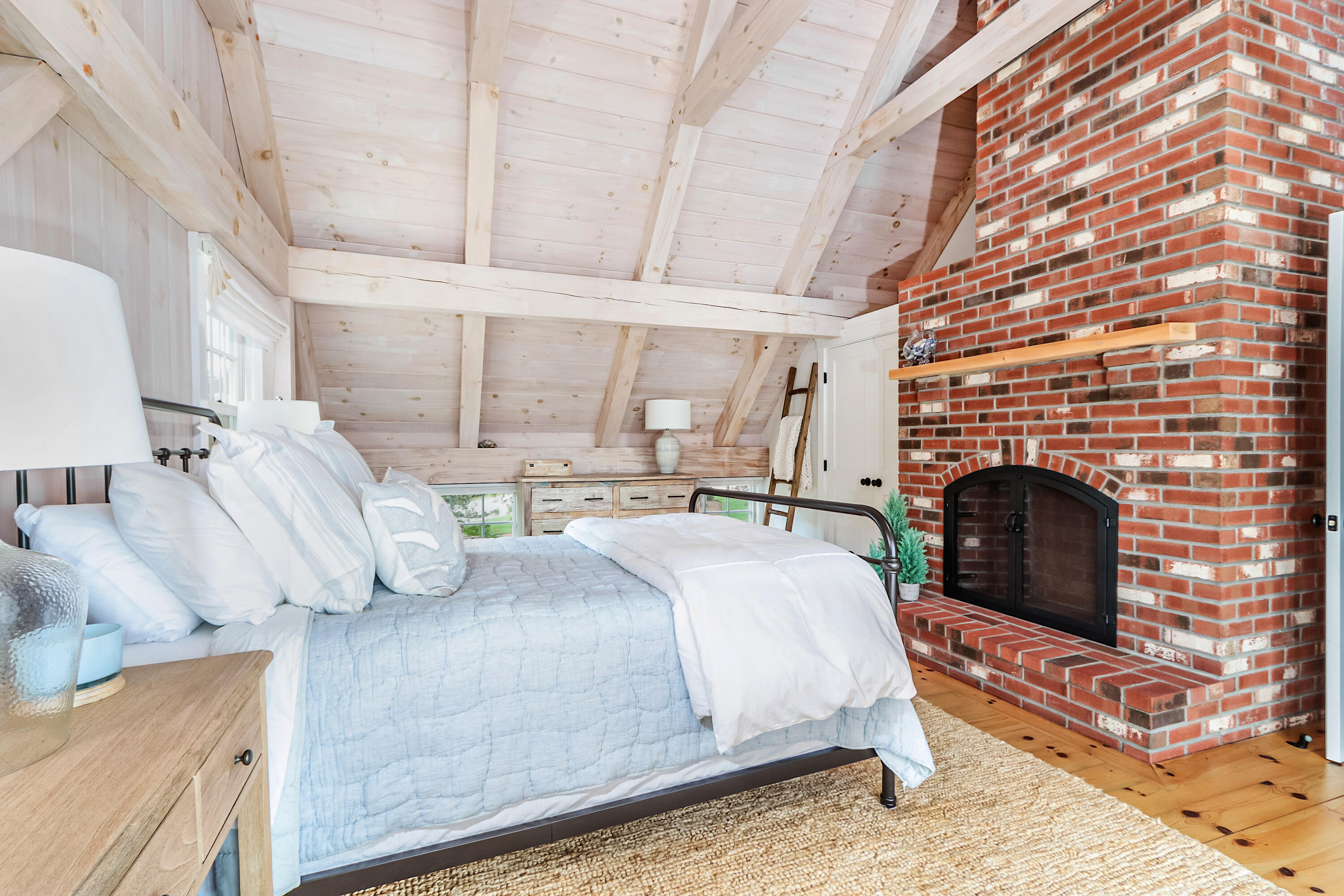 330 Sandy Neck Road West Barnstable, MA 02668 - Photo 28 of 45 a bedroom with a bed and a fireplace