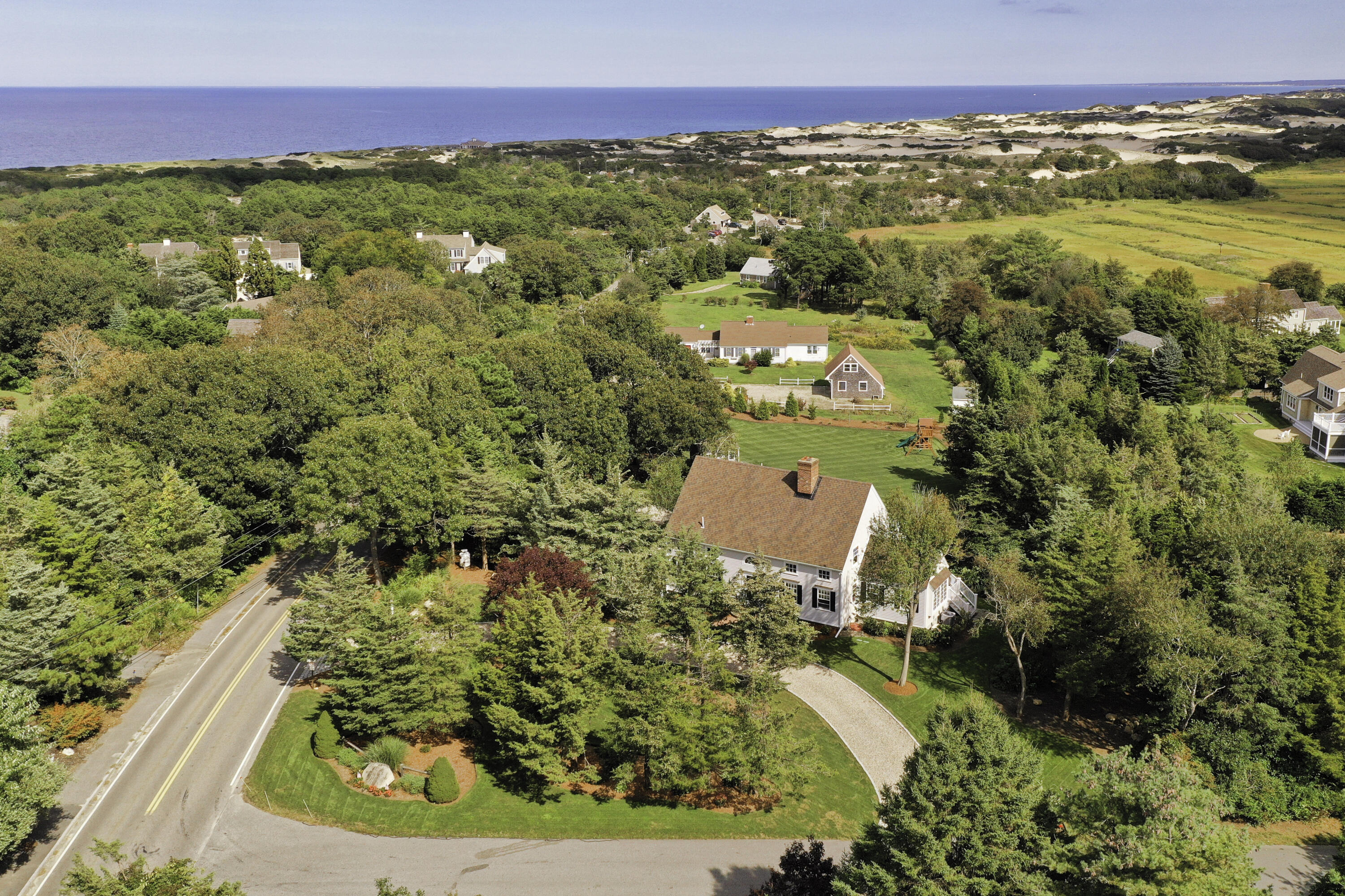 330 Sandy Neck Road West Barnstable, MA 02668 - Photo 40 of 45 an aerial view of residential houses with outdoor space