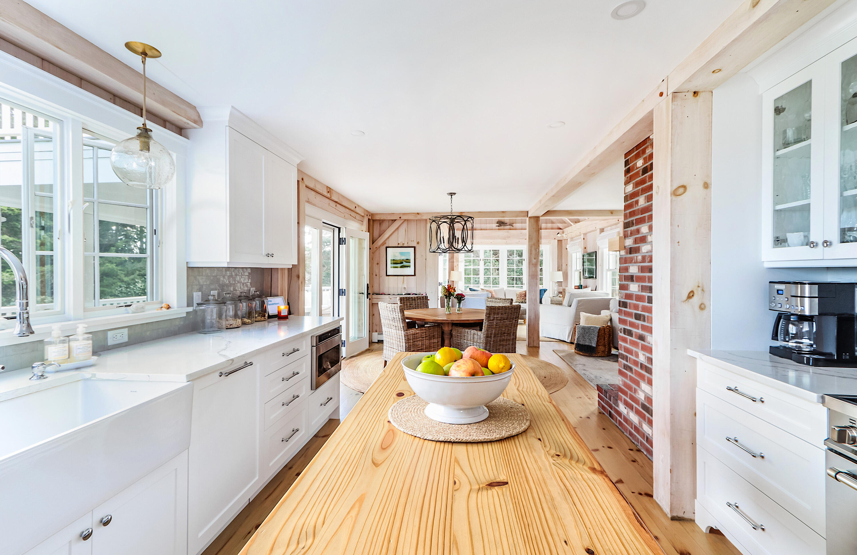 330 Sandy Neck Road West Barnstable, MA 02668 - Photo 6 of 45 a large white kitchen with a large window and cabinets