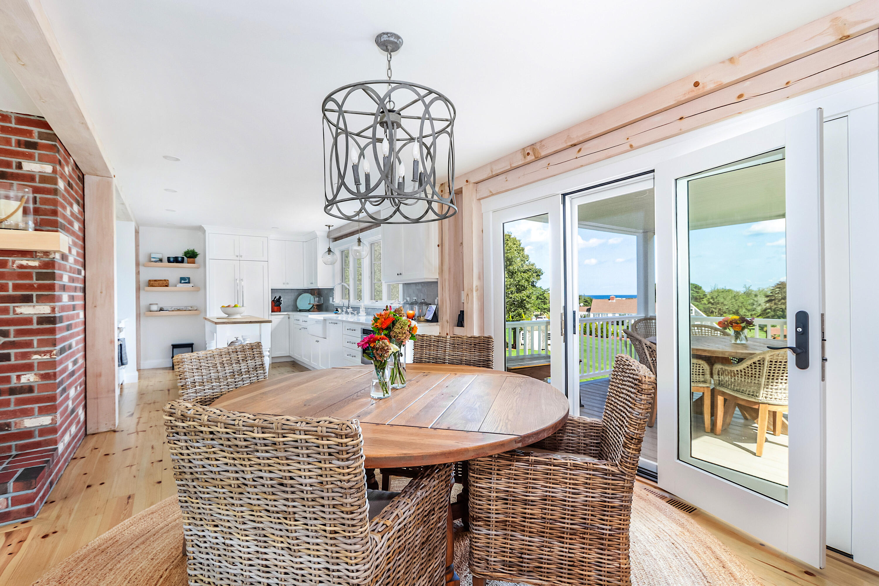330 Sandy Neck Road West Barnstable, MA 02668 - Photo 10 of 45 a dining room with furniture a chandelier and window