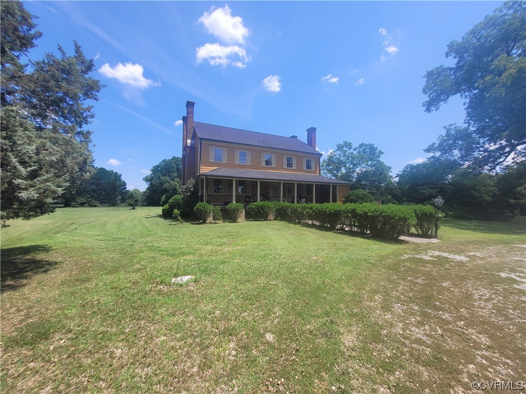 3922 Courtland Road Disputanta, VA 23842 - Photo 3 of 22 a view of a house with backyard and a garden