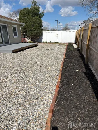 a view of a backyard of the house