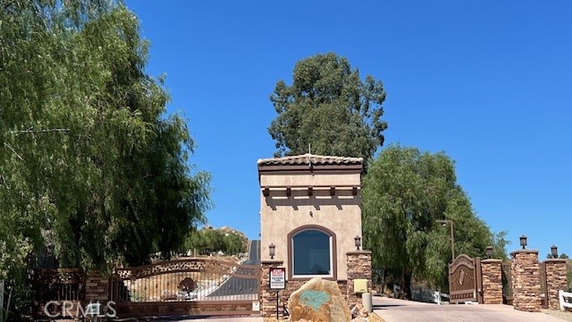 a barbeque view with couches and a fire pit