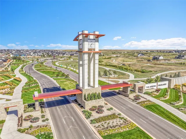 a view of city from balcony with furniture