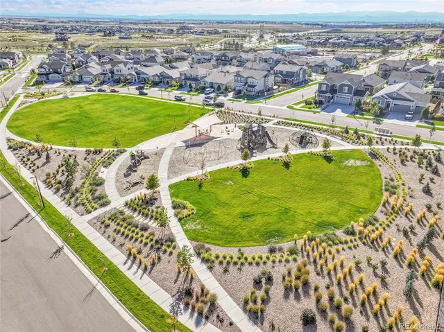 an aerial view of a swimming pool and mountain view