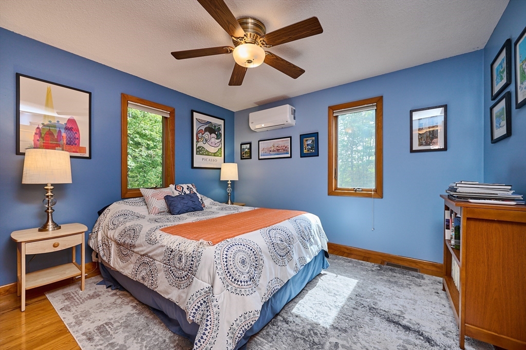 65 Edwards Road Westhampton, MA 01027 - Photo 21 of 38 a bedroom with a bed and a chandelier