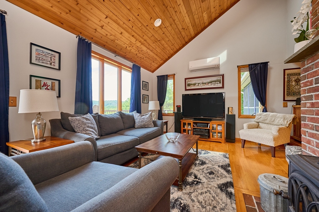 65 Edwards Road Westhampton, MA 01027 - Photo 8 of 38 a living room with furniture and a flat screen tv