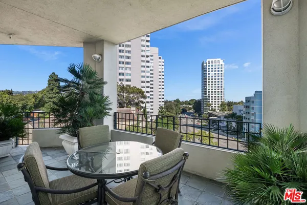 a view of a balcony with chairs