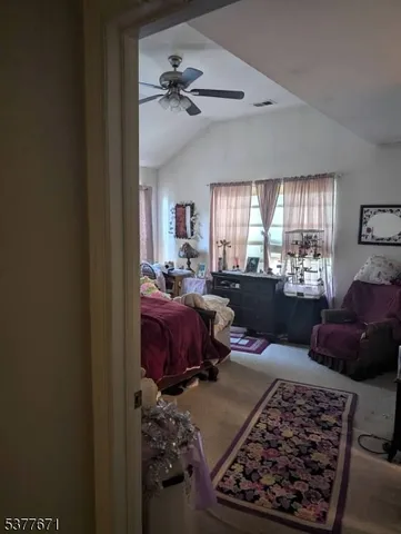 a bed room with a bed window and couch