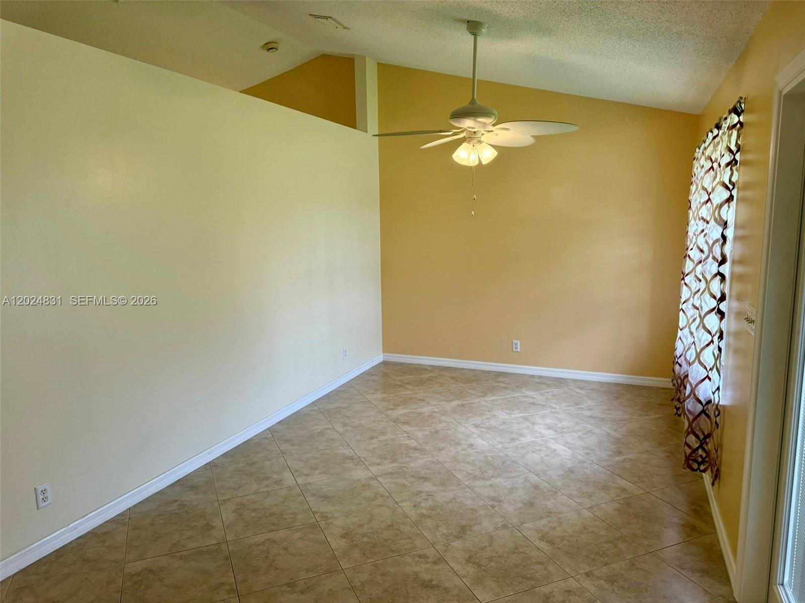 15819 76th Road North Loxahatchee, FL 33470 - Photo 10 of 45 a view of an empty room with chandelier fan