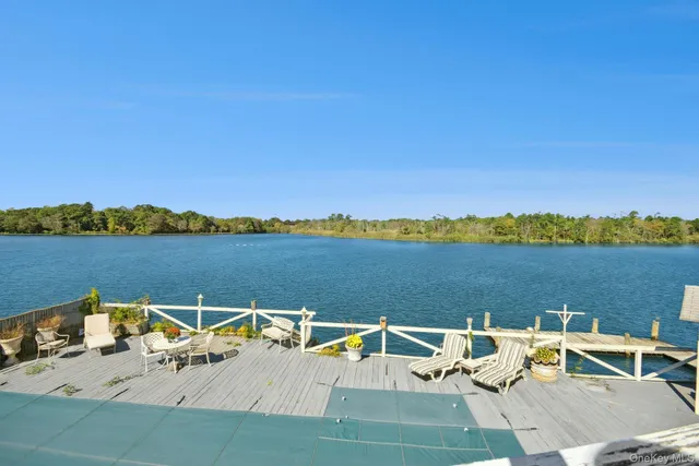 a bedroom with a bed and a book shelf