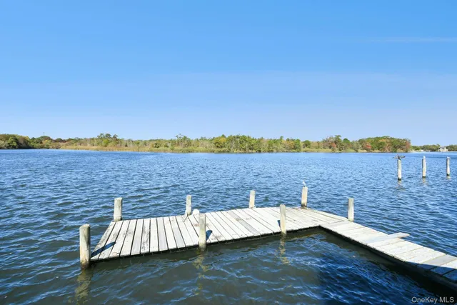 a view of a lake with outdoor seating