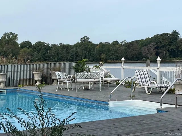 a view of a swimming pool with lounge chair