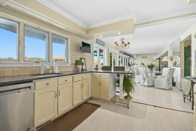 a very nice looking room with a large window and white walls