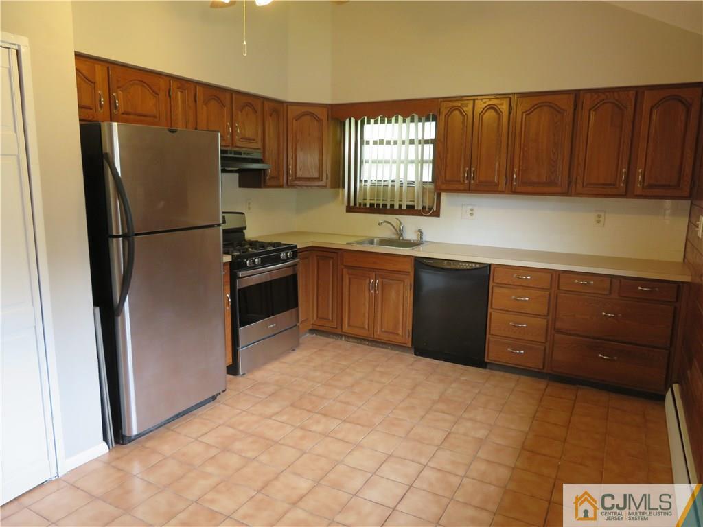 50 Hickory Road Colonia, NJ 07067 - Photo 2 of 16 a kitchen with stainless steel appliances granite countertop a refrigerator sink and cabinets