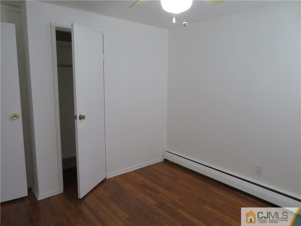 50 Hickory Road Colonia, NJ 07067 - Photo 13 of 16 a view of empty room with wooden floor