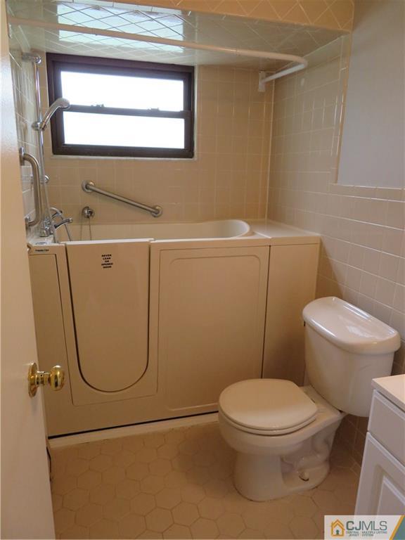50 Hickory Road Colonia, NJ 07067 - Photo 15 of 16 a bathroom with a toilet and a shower