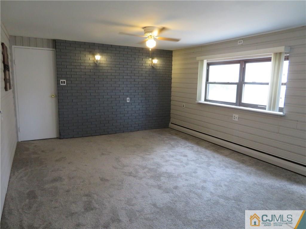50 Hickory Road Colonia, NJ 07067 - Photo 6 of 16 a view of an empty room with a window