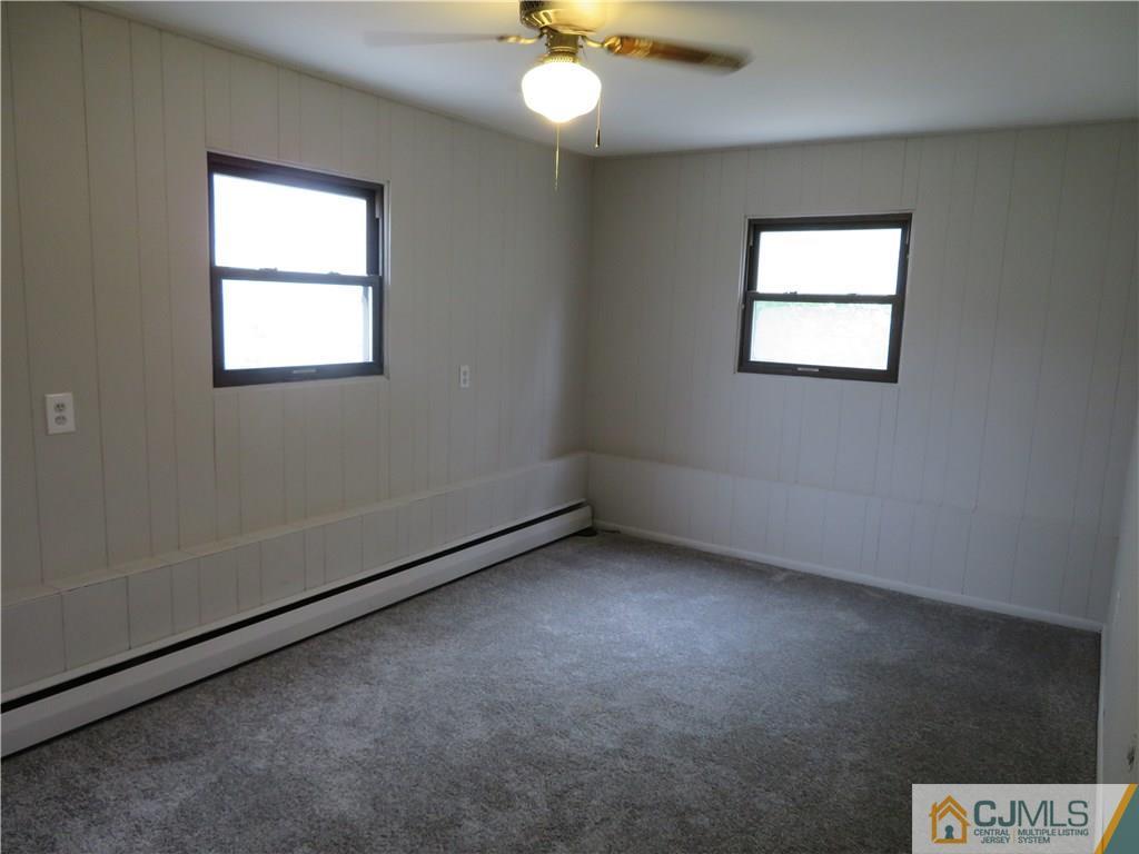 50 Hickory Road Colonia, NJ 07067 - Photo 7 of 16 an empty room with a window