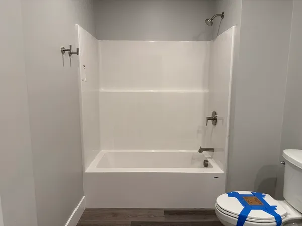 a bathroom with a bathtub toilet and sink