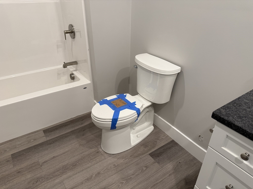 251 Sladen Street, Unit 103 Dracut, MA 01826 - Photo 14 of 27 a bathroom with a sink and a vanity