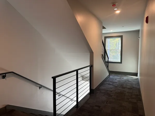 a view of a hallway with staircase