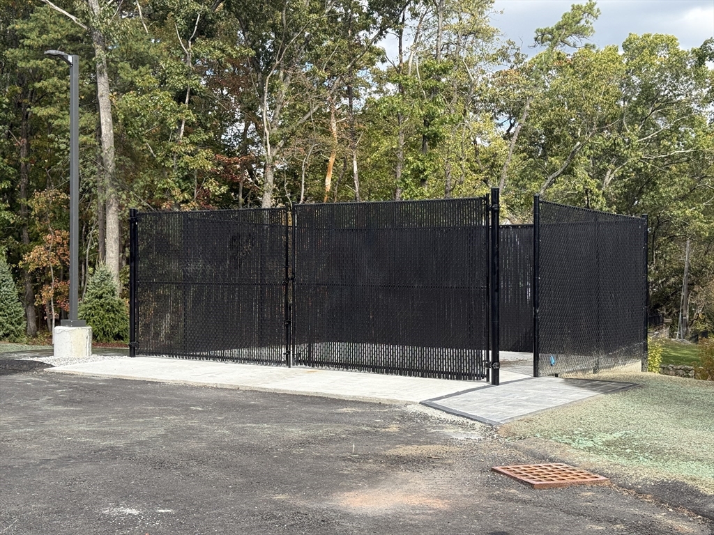 251 Sladen Street, Unit 103 Dracut, MA 01826 - Photo 26 of 27 a view of wooden fence
