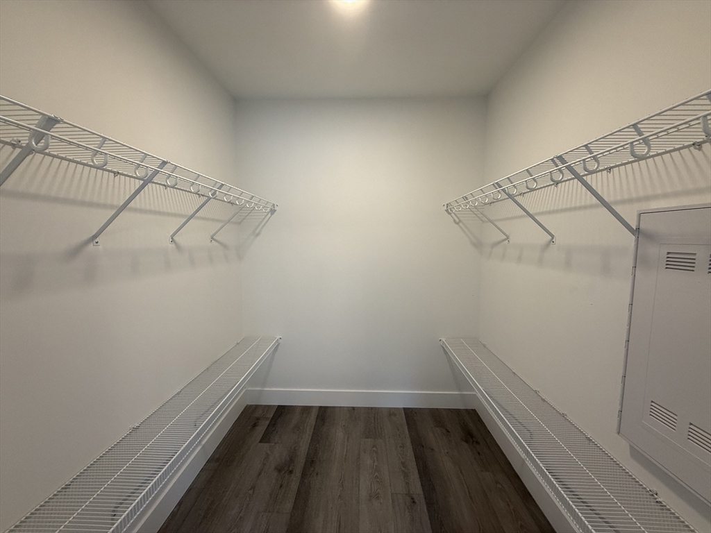 251 Sladen Street, Unit 103 Dracut, MA 01826 - Photo 10 of 27 a view of a room with racks on the wall