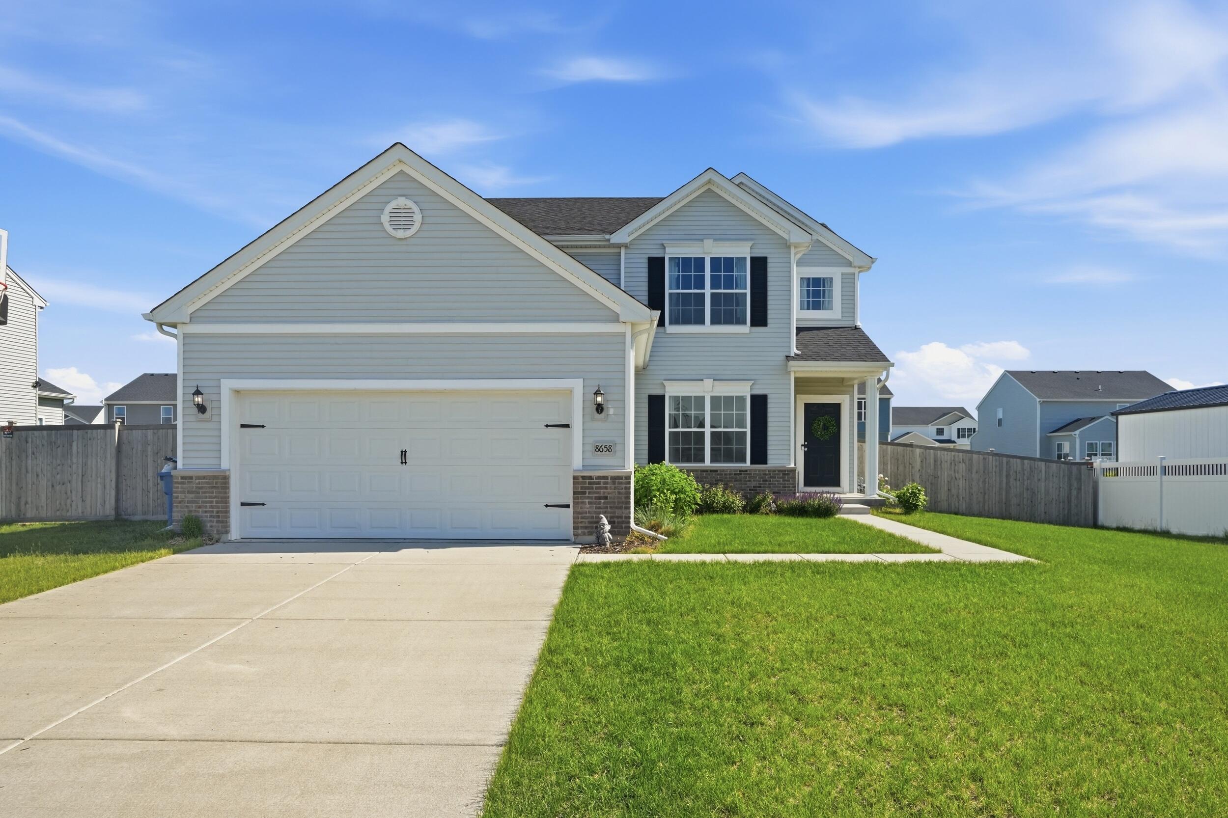 8658 Valley Forge Way Lowell, IN 46356 - Photo 1 of 23 a front view of a house with a yard