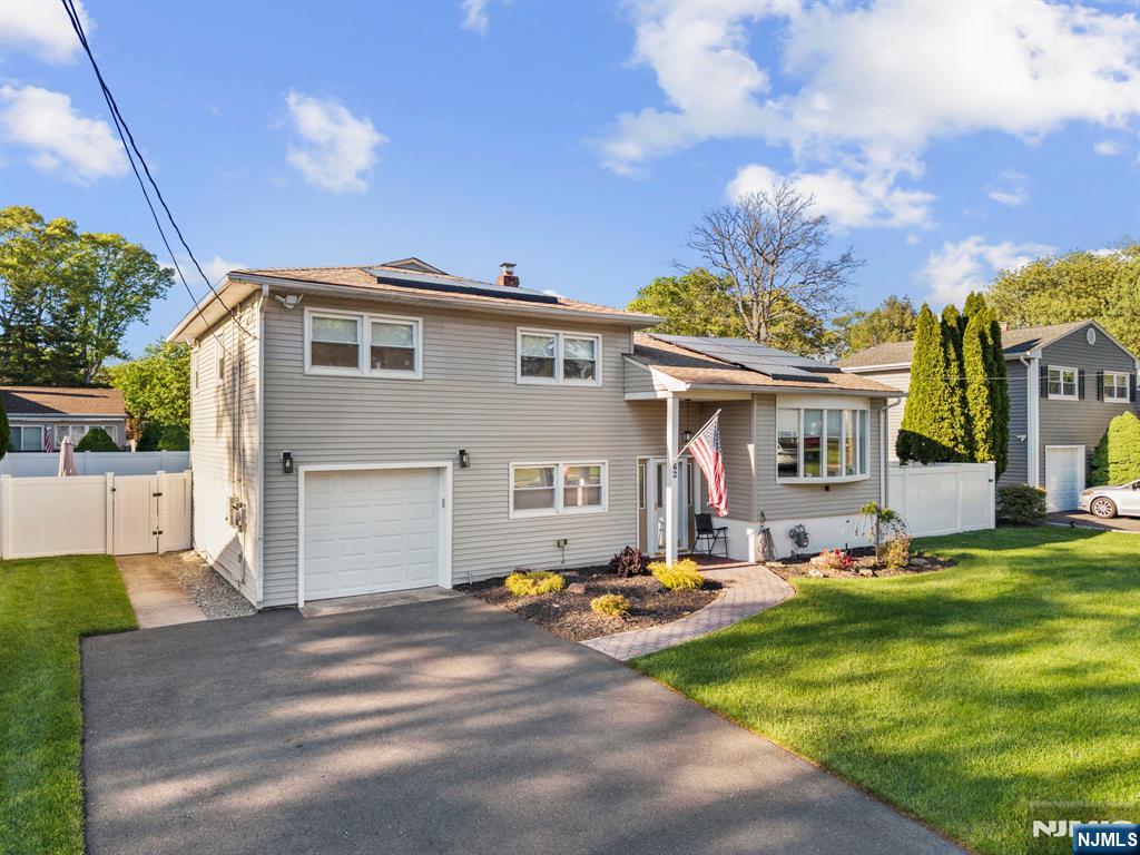 62 Sycamore Road Dumont, NJ 07628 - Photo 41 of 43 a front view of a house with a yard
