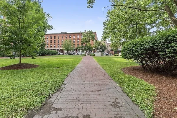 a view of street with parked cars