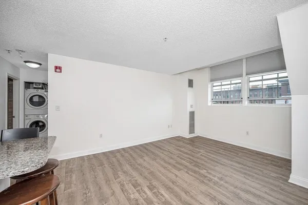 a view of a hardwood floor in a room
